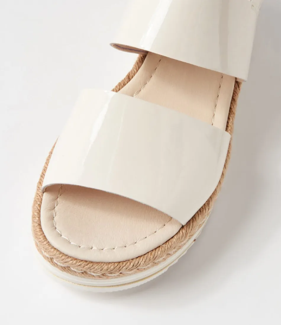 Sandales Élégantes Django & Juliette - Espadrilles Confortables en Toile et Cuir Verni Ivoire Atha 

Nuances Estivales : Modèle Femme en Cuir Laqué Brillant avec Semelle Tressée - Collection Printemps-Été