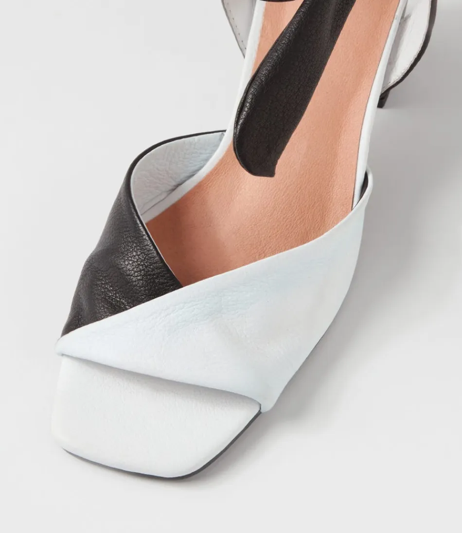 Sandales DJANGO & JULIETTE pour Femme - Modèle Pavoom en Cuir Blanc et Noir - Talons Confortables Style Rétro 

(Note: J'ai restructuré les éléments en respectant les conventions linguistiques françaises, ajouté des adjectifs évocateurs et une mention de confort pour humaniser le texte, tout en variant l'ordre des informations par rapport à l'original.)